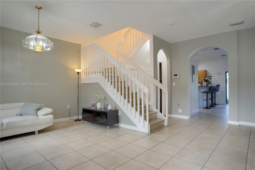 Beautifully maintained 3-bedroom, 2.5-bath two-story townhouse offered at a great price in desirable Bellagio Villas. Built in 2014, this 1,574 sq. ft. home features a bright open layout, tile flooring on the first floor, and laminate wood upstairs. The upgraded kitchen with stainless appliances flows to a private paved and fenced patio, perfect for relaxing or entertaining. The primary suite includes a private bathroom, while the additional bedrooms share a full bath. The washer and dryer add convenience, and impact windows provide extra security. Enjoy assigned parking spaces plus ample guest parking in this safely gated & walled, FHA-approved community with low maintenance fees. Resort-style amenities include a pool, clubhouse, fitness center, and playground. Just minutes from I-75, shopping, dining, and top-rated schools, this home is ideal for first-time buyers or investors.