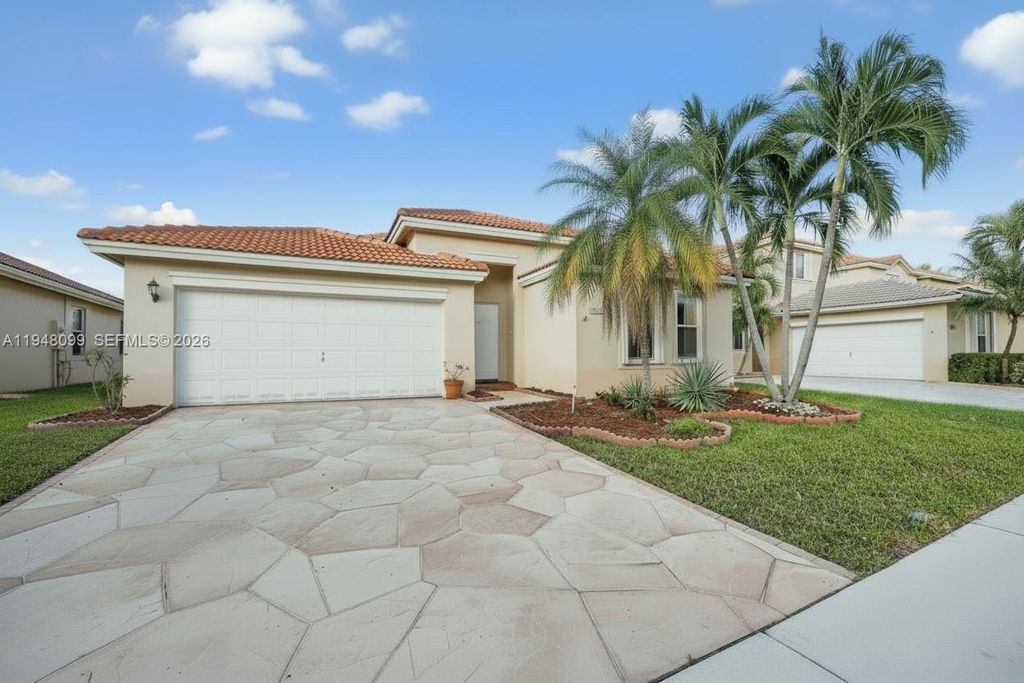 Photo of 14125 S Cypress Cove Cir, Davie, FL 33325 (MLS # A11948099)