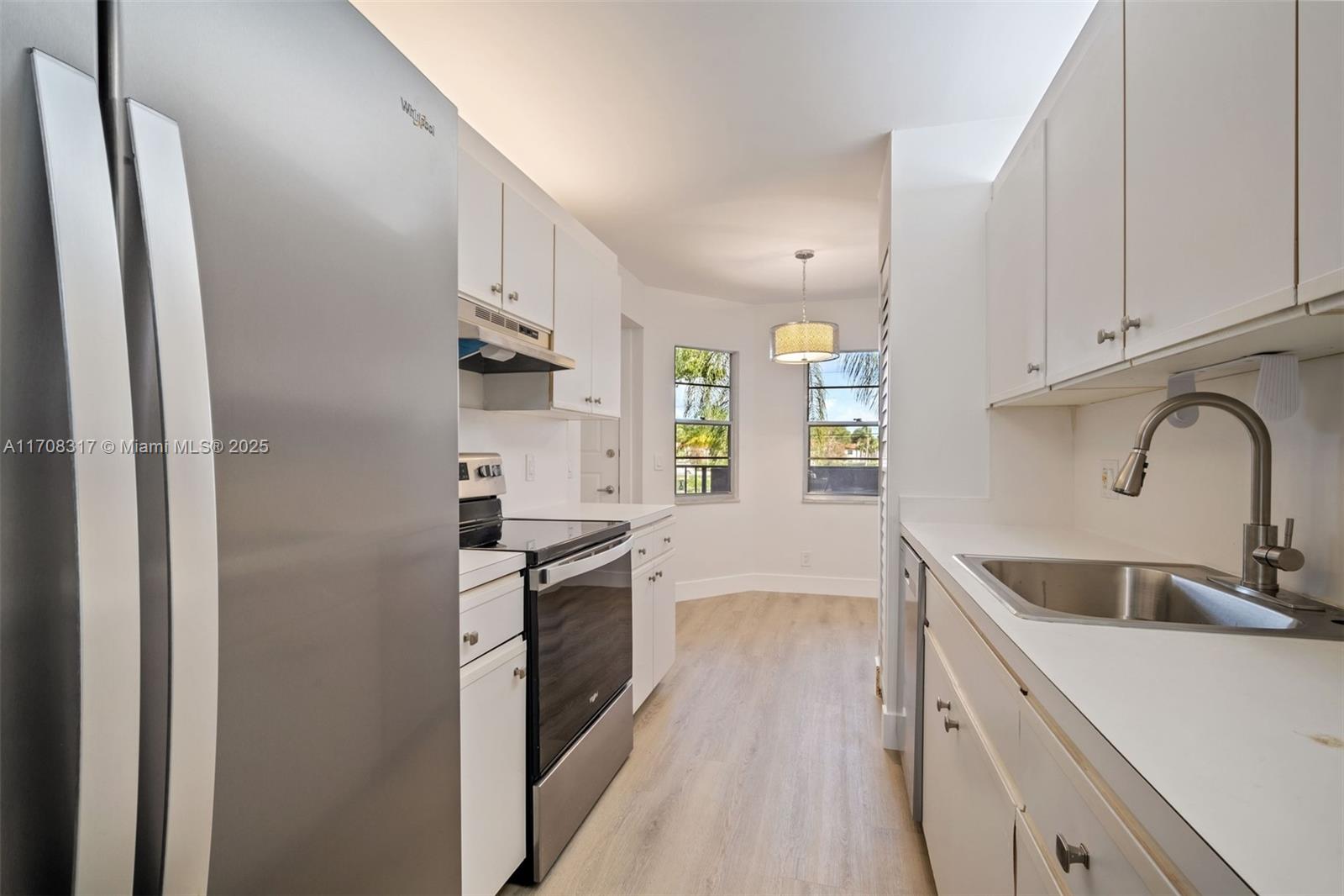 OWNER FINANCING AVAILABLE! Building O is located on the east side of Century Village. This second-floor unit, conveniently next to the elevator, offers a patio with views of the lush green courtyard, enhanced by a tree providing privacy and afternoon sun protection. A washer and dryer are located within the unit, and the secondary bedroom has a spacious walk-in closet for storage or standard use. Recently renovated, the property features never-used kitchen appliances, new flooring, fresh paint, and updated fixtures. Minutes away from Pembroke Crossings, where you can find all the shopping and restaurants. Enjoy the exceptional amenities Century Village has to offer.