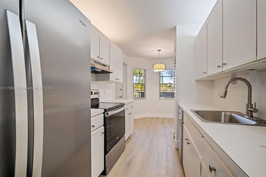 OWNER FINANCING AVAILABLE! Building O is located on the east side of Century Village. This second-floor unit, conveniently next to the elevator, offers a patio with views of the lush green courtyard, enhanced by a tree providing privacy and afternoon sun protection. A washer and dryer are located within the unit, and the secondary bedroom has a spacious walk-in closet for storage or standard use. Recently renovated, the property features never-used kitchen appliances, new flooring, fresh paint, and updated fixtures. Minutes away from Pembroke Crossings, where you can find all the shopping and restaurants. Enjoy the exceptional amenities Century Village has to offer.