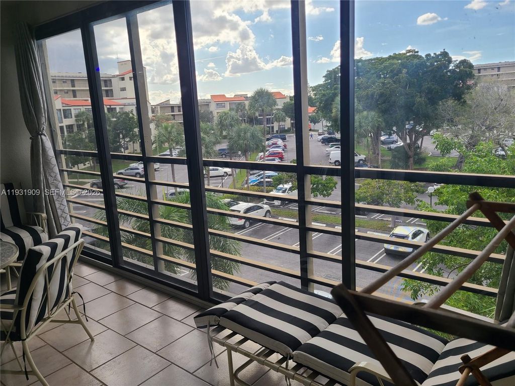 Photo of 2306 S Cypress Bend Dr #418, Pompano Beach, FL 33069 (MLS # A11931909)
