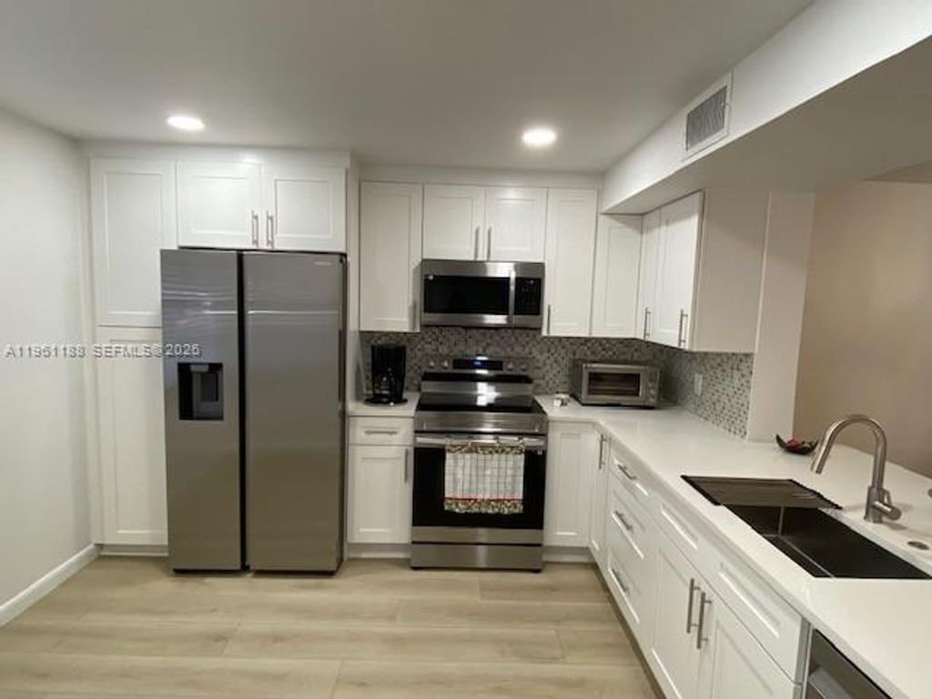 Photo of 3305 Aruba Way #B1, Coconut Creek, FL 33066 (MLS # A11961188)