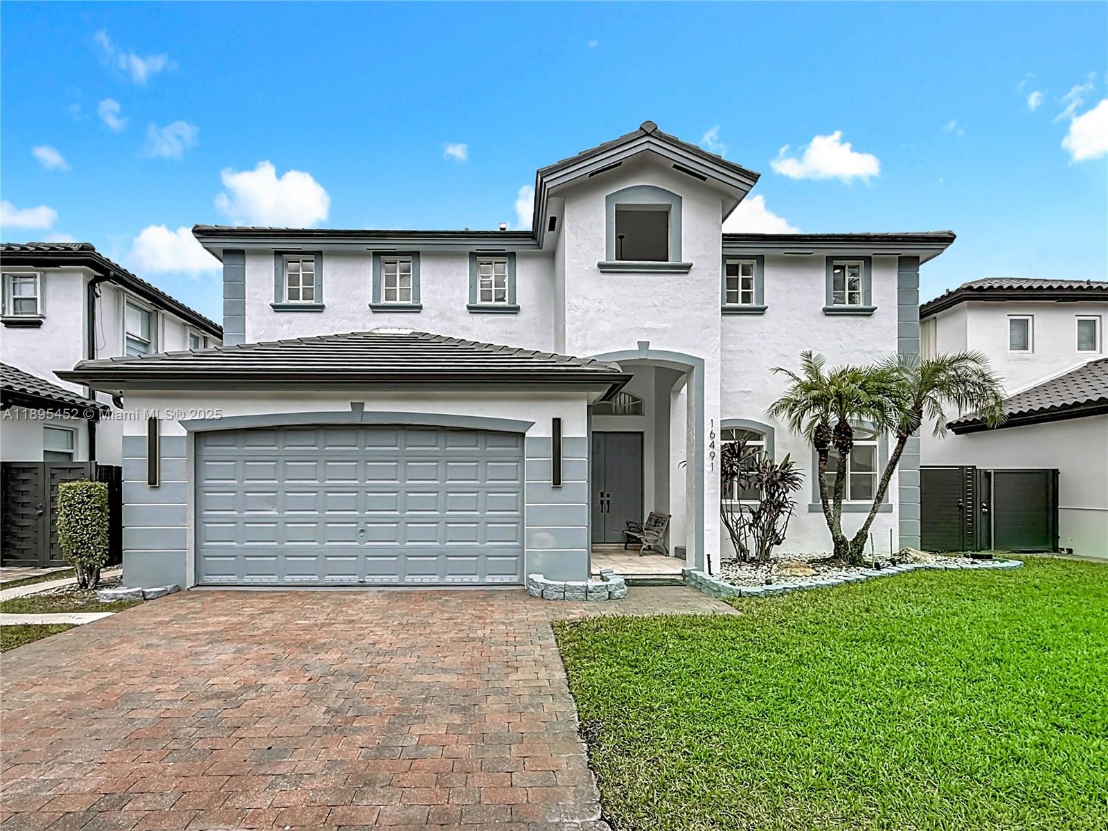 Welcome to luxury living in West Kendall! This beautifully remodeled 4BR/3BA home features a brand-new roof, new water heater, 2-year-old A/C, new floors, and new bathrooms. The stunning kitchen has been fully remodeled with stainless steel appliances and a wine cooler, flowing into open living spaces. The primary bedroom is on the first floor with custom walk-in closets. French doors lead to the back patio and pool, perfect for entertaining. Located in a desirable neighborhood with top-rated schools within walking distance. Includes a 2-car garage and driveway parking. Schedule your tour today!