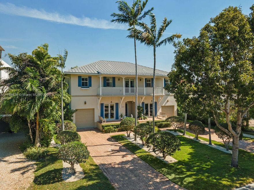 A rare find in a prime location on prestigious Harbor Drive, this elegant 5-bed, 6.5-bath residence is a true treasure for Key Biscayne. It offers comfort, privacy and timeless design. The home exudes a warm, homey feel with formal living and dining areas, a welcoming family room, and an informal dining space. A standout feature is the expansive outdoor living all second-floor bedrooms open to generous terraces overlooking beautiful, lush greenery, while the backyard serves as a private oasis with multiple lounging areas, a spacious covered terrace, and a resort-style pool perfect for entertaining. Each suite has its own bathroom. Additional features are a cabana bath, powder room, two garages, refined finishes that complete this exceptional offering. Easily convertible to six bedrooms.