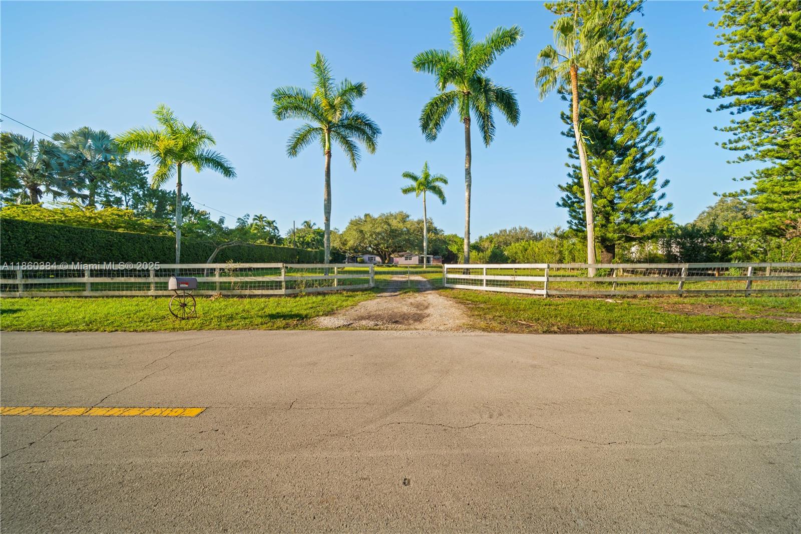 Don't miss this unique chance to invest in Davie! Unlock the potential of this exceptional property, situated on nearly an acre of tropical land in Davie. Ideal for investors and homebuyers alike, this lot offers endless possibilities for development in a serene, equestrian-style neighborhood with no HOA. The existing 3-bedroom/2-bath house is perfect for a tear-down, allowing you to build your dream home. Established utility connections and potential cost savings on permits make this an attractive option. With plenty of room for parking boats, RVs, horse trailers, and other equipmnt, this property caters to those with an active lifestyle. Minutes from major highways, top-rated schools, shops & restaurants,this property blends convenience and tranquility.Showing Time for APPTS.24 hr Notice