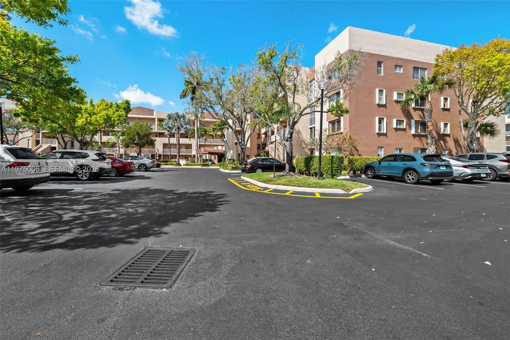 Photo of 7641 Granville Dr #209, Tamarac, FL 33321 (MLS # A11975006)