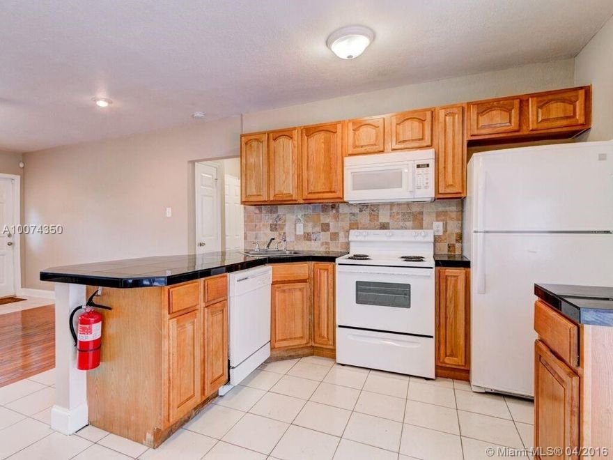 DON'T MISS THIS GREAT HOME FOR FIRST TIME HOME BUYER OR INVESTOR! 4 BEDROOM, 2 BATH HOME WITH A ONE CAR GARAGE. LARGE FENCED YARD WITH ROOM FOR A POOL. HOME HAS AN UPDATED KITCHEN W/GRANITE COUNTERS AND OAK WOOD CABINETS. TILE FLOORS IN KITCHEN AND DINING AREA. LIVING ROOM HAS REAL WOOD FLOORING. BEDROOMS HAVE LAMINATE. BOTH BATHROOMS HAVE SOME UPDATES. SEPARATE LAUNDRY ROOM WITH STORAGE. LARGE DECK IN THE BACK YARD. NEWER ROOF. CLOSE TO ALL MAJOR HIGHWAYS, DOWNTOWN FT LAUDERDALE, NEW WALMART SUPERCENTER.