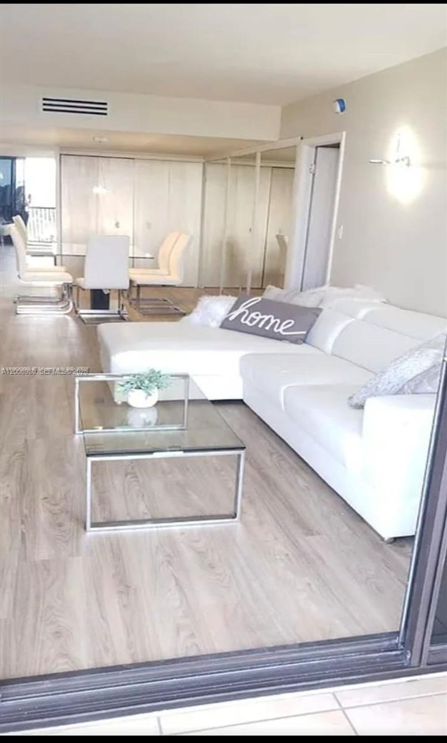 Beautifully renovated and move-in ready 2-bedroom, 2-bath residence located in one of the most desirable and safest areas in South Florida—the city of Aventura. This bright and spacious unit features a modern open layout with elegant finishes throughout, including wood-style flooring and generous closet space. The updated kitchen offers sleek cabinetry, quartz countertops, and stainless steel appliances, while the living and dining areas are filled with natural light and open to a private balcony with beautiful golf and lake views.

Tastefully furnished with contemporary décor, this home creates a warm and inviting atmosphere. Both bathrooms have been fully renovated with high-quality finishes. The primary suite offers a peaceful retreat with an upgraded en-suite bathroom.

Ideally located across from Aventura Mall, with world-class dining and shopping, and surrounded by a scenic 3-mile walking/jogging path. Just minutes to I-95 and only 3 miles from the beach, with convenient access to both Miami International and Fort Lauderdale airports.

Includes storage unit. HOA covers cable, internet, and water. Laundry on the same floor. Building has passed 40-year certification. Rentals allowed after 1 year (2-year minimum lease). Perfect for end-users or investors.