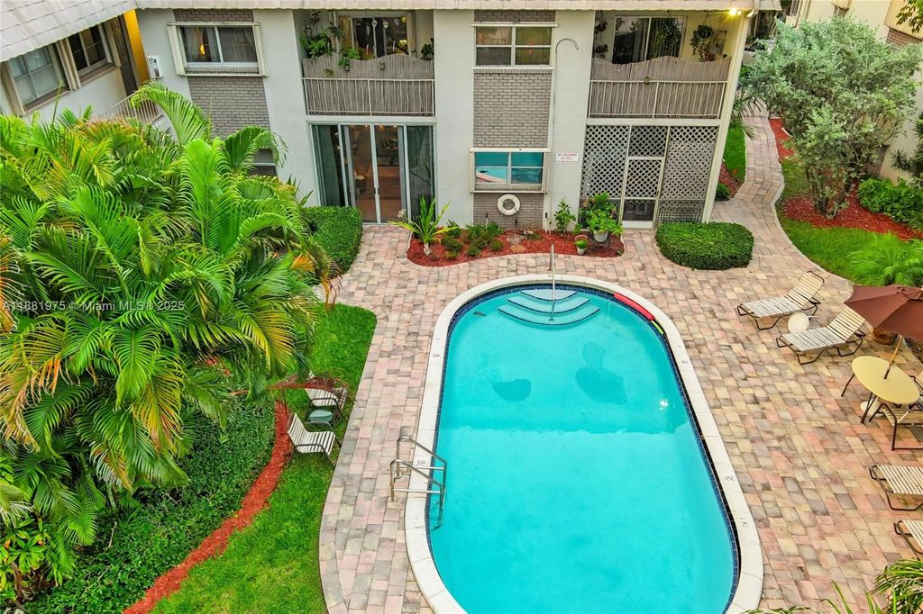 Photo of 1541 NE 34th Ct #104, Oakland Park, FL 33334 (MLS # A11881975)