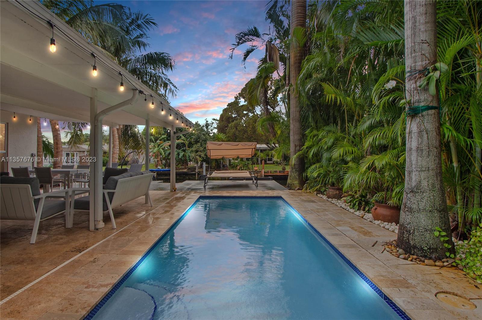 Amazing Property in Hollywood, pool home on a canal. Large open floor plan with large master bedroom and bathroom. Impact resistant windows and doors throughout. Salt water SOLAR HEATED POOL. Stainless appliances and tankless water heater. GORGEOUS BACKYARD with pool overlooking canal which leads to the ocean. Huge carport and laundry room. JACUZZI TUB in the oversized master bath. His and her closets in the master bedroom. For investment is Money machine, Great for AIRBNB, ask for numbers, close to FLL Airport, beach, ocean access for Boat lovers, Furnished, just ready to enjoy this property