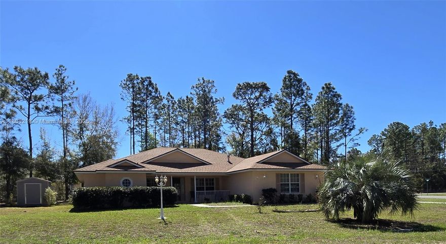This custom home offers over 3,000 sq ft under the roof and 2,400 sq ft under air on a spacious 12,000 sq ft lot with a storage shed. The 4-bedroom split floor plan has two bedrooms and a bath on each side. new matching granite vanity counters in both bathrooms The main suite opens to a screened, tiled patio. Patio includes ceiling fans and gas hookup for grill. The kitchen includes a breakfast nook Plantation shutters throughout, vaulted living room ceilings, a tray ceiling in the main bedroom, and a laundry room with a gas dryer and sink. Enjoy a 2-car garage, a gas stove, and a tankless water heater. The roof is just one year old with metal-covered fascia and soffit. Ask about other upgrades.