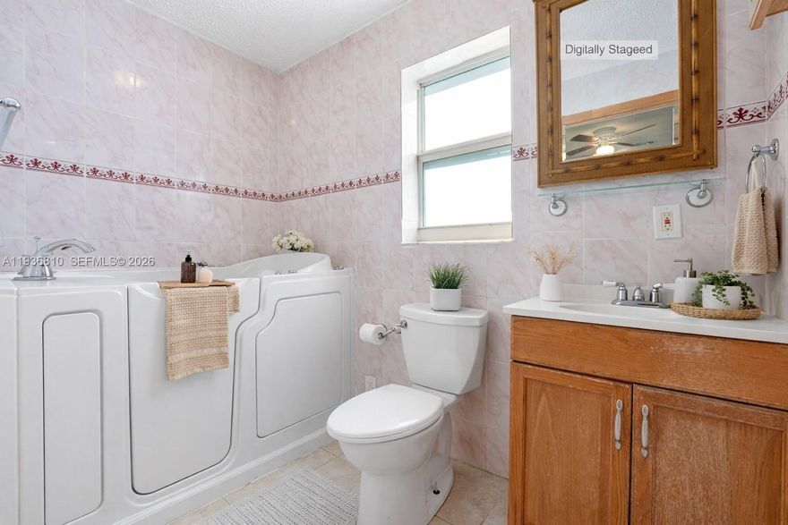 High impacted hurricane window home, with low HOA dues *$145 quarterly, 55+ community offering two pools *one heated*, a clubhouse, shuffleboard, and scheduled activities—all with a . This freshly painted home features a tankless water heater and a wheelchair-accessible shower. Conveniently located near the Florida Turnpike and Sawgrass Expressway for easy access to shopping, dining, and more.