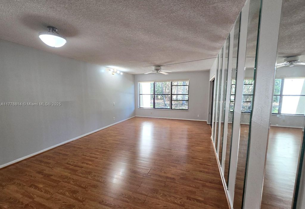 Photo of 2313 S Cypress Bend Dr #123A, Pompano Beach, FL 33069 (MLS # A11778814)