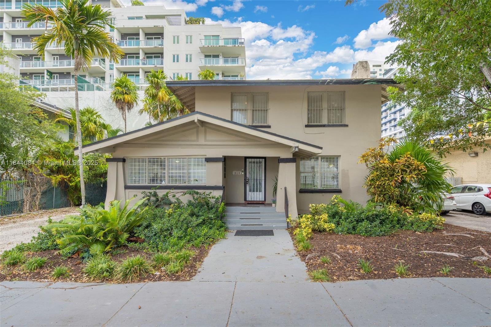 Live-Work, House-Hack, or Re-Imagine! Rare 2-story property in the heart of red-hot Edgewater on a 5,340?SF corner lot(60?×?89, T6-36A-O Urban-Core zoning).Upstairs offers 3 spacious bedrooms & 2 baths, lofty ceilings, abundant natural light, and skyline glimpses. Ground level delivers 3 more bedrooms & 1 full bath each floor has its own private entry and no interior connection, making the home perfect for multi-generational living, income-producing duplex, short-term rental, or seamless conversion to an expansive single-family residence. Steps to Biscayne?Bay, Margaret?Pace Park, Design?District, Wynwood cafés, and Brightline station. Sold as-is with endless upside: remodel, combine, or develop new under generous high-density zoning. No HOA.A unique Edgewater canvas ready for your vision!