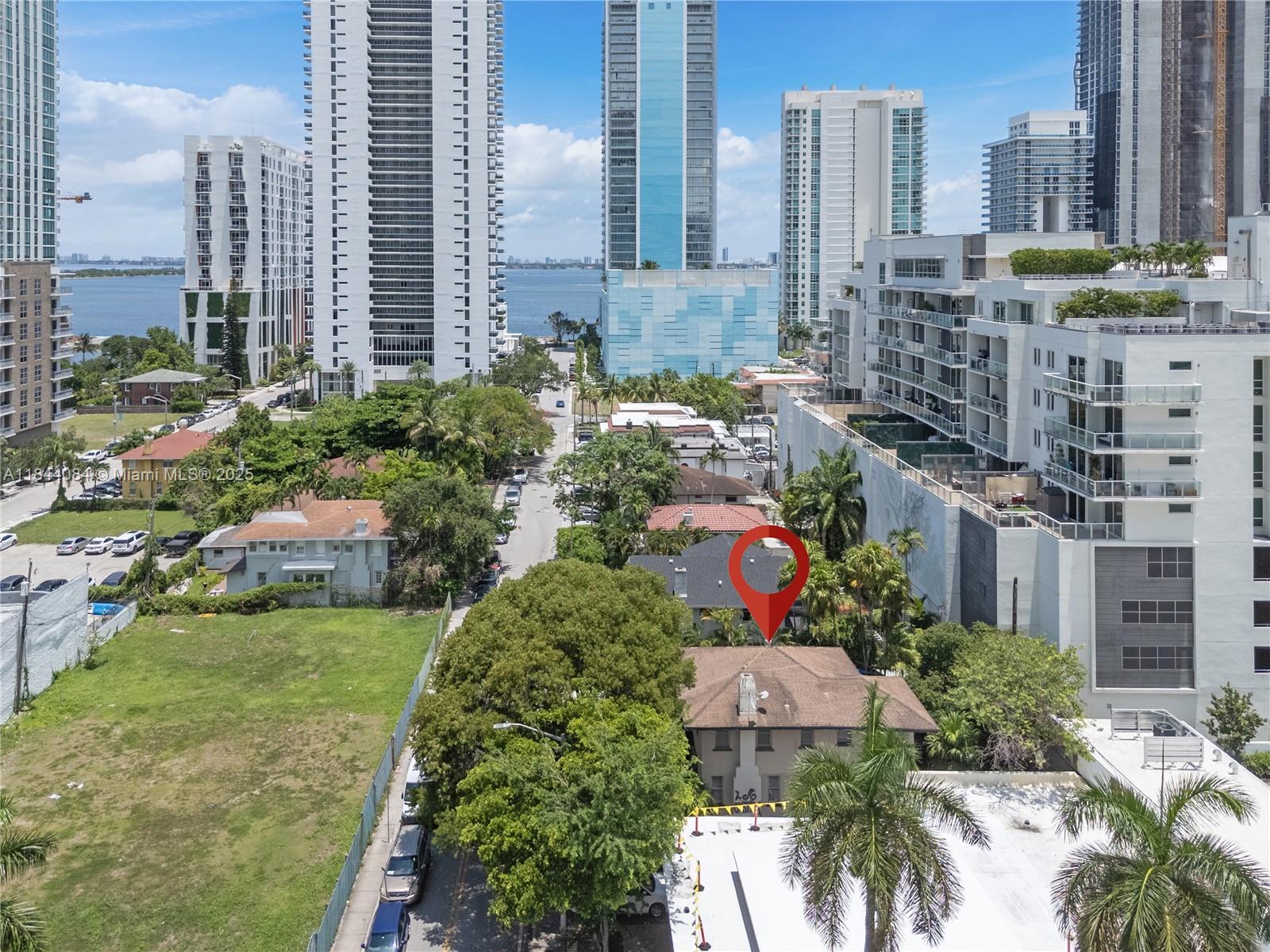 Edgewater Live-Work Gem! Versatile two-story residence on a 5,340 SF lot (60×89) steps from Biscayne Bay, Margaret, Pace Park, Design District & Wynwood. Upstairs offers 3 bedrooms | 2 baths, lofty ceilings and city-view windows; downstairs delivers 3 bedrooms | 1 bath with direct yard access—each floor has its own exterior entry, allowing multi-generational living, house-hack income, or an easy conversion to a single grand home. Lot is zoned T6-36A-O Urban-Core for maximum future upside. Fresh exterior paint, gated parking, fenced yard, full laundry on site, no HOA. Enjoy unbeatable walkability, quick Brightline access, and Edgewater’s explosive growth while owning a property that can evolve with your vision. 3-D virtual tour available—click the link!