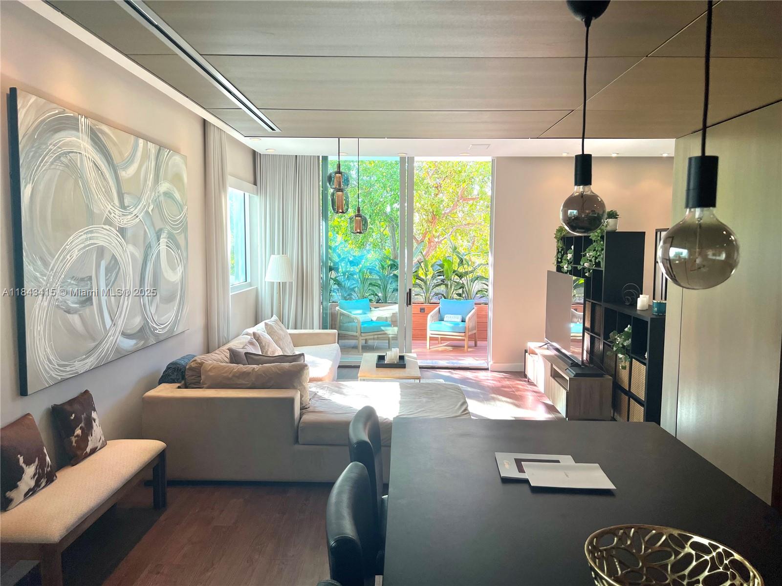 Beautiful upgraded 2 bedroom / 2 bath open layout loft style condo. Over 1,000 adj sq ft completely designed with top of the line finishes. Light wood floors throughout, bleached oak wood paneling on the walls, upgraded kitchen with granite countertops and subzero refrigerator, bathrooms with slate tiles and Waterwoks fixtures, finished closets, electric shades, and beautiful balcony with wood decking. Covered parking space, rooftop pool, just minutes from Lincoln Road in the heart of South Beach. Must see! 6 MONTHS RENTAL AVAILABLE AT HIGHER RATES.