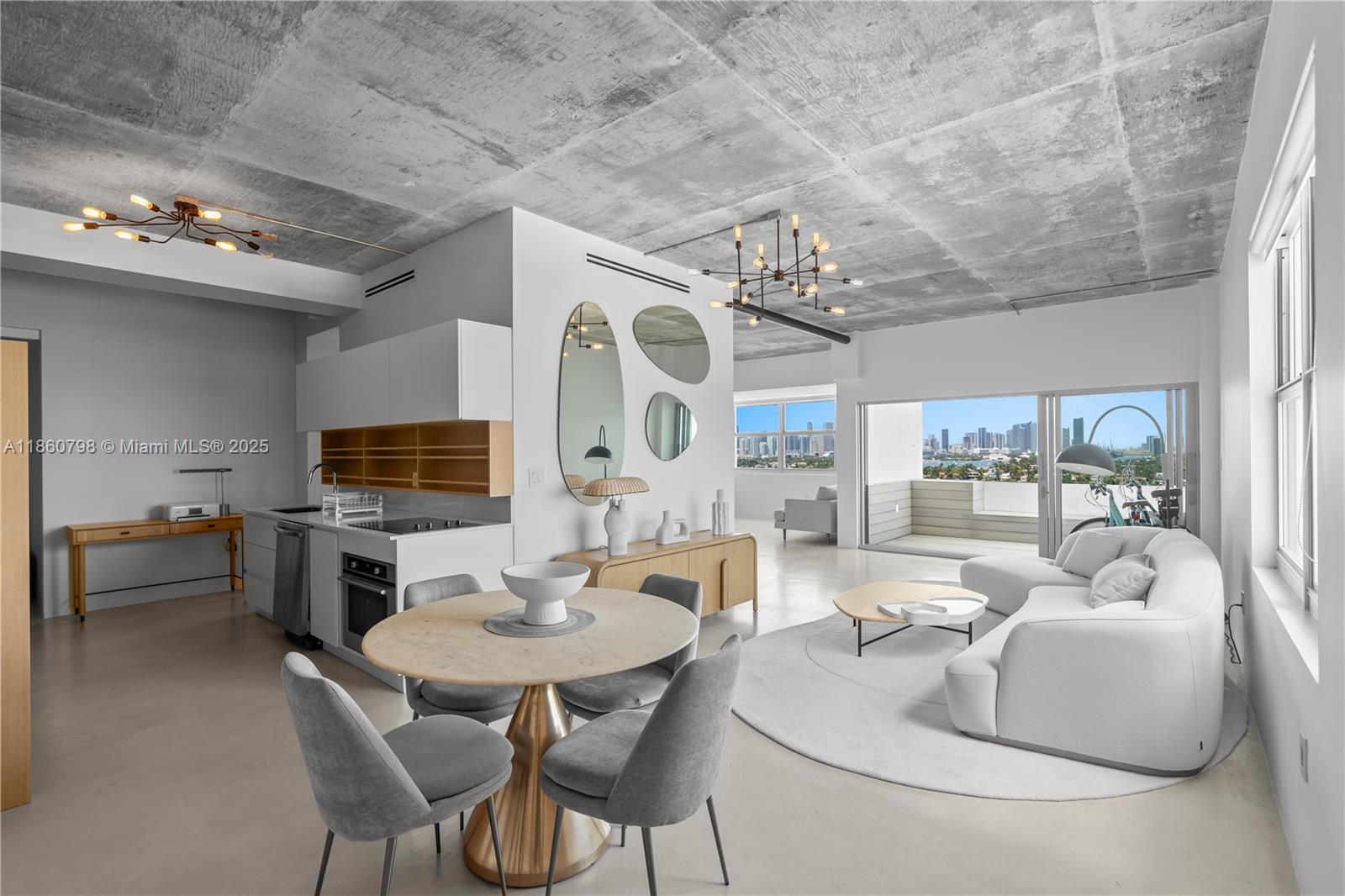 3 ISLAND AVENUE, PHD, Miami Beach Modern, minimalist, and perfect. In this penthouse, exponed concrete, wood and stone elements, architectural lighting, and floating cabinetry created a blank canvas, a calm retreat from any busy urban life. In the foreground, expansive views of turquoise water, lush landscaped homes on surrounding islands, and the Miami skyline provide a quintessential subtropical view, the kind that postcards are made of. This remodeled penthouse features an open kitchen, a walk-in closet. 10" cellings, Impact windows, an open balcony, and views as for as the eye can see. Located on the Venetian Islands, this residence is very Close to The Standard, Sunset Harbour, and Lincoln Road.