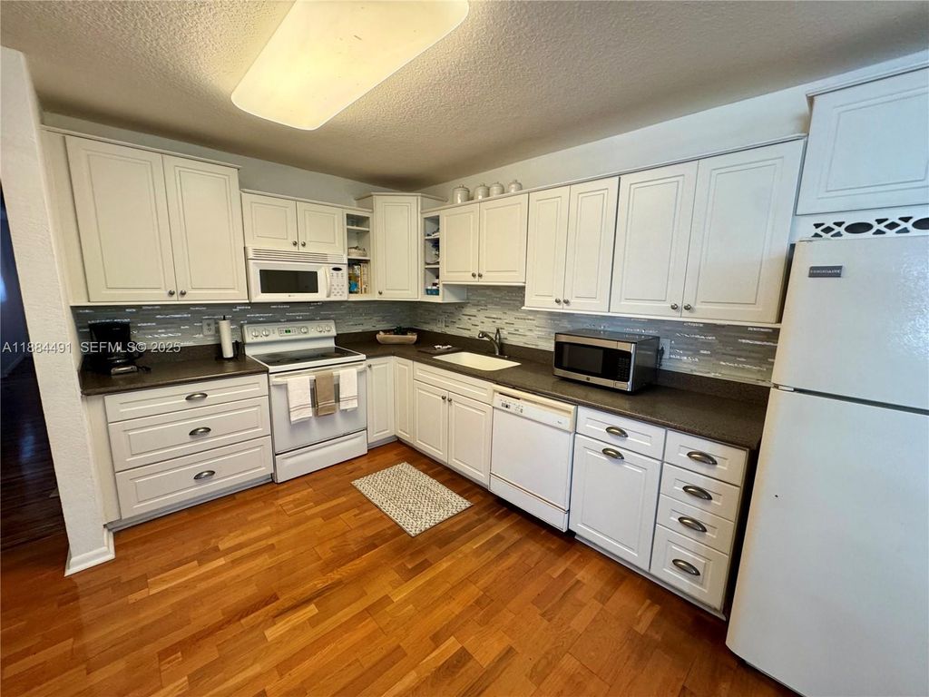 Photo of 4140 NW 110th Ave, Coral Springs, FL 33065 (MLS # A11884491)