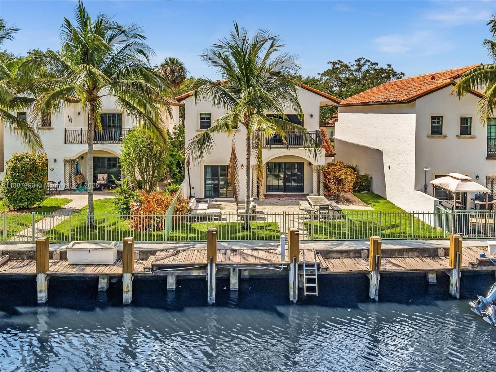 Waterfront Single Family Home with a "Private Dock" in Hidden Harbour! Live the South Florida lifestyle in this spacious 4 bedroom, 3.5 bath home located in the gated community. This beautifully maintained property offers an open floor plan, updated Kitchen, and tranquil water views, Boating enthusiasts will love the private dock with direct access to the Intracostal - bring your boat and enjoy the water from your own backyard! Just minutes from the beach, airport, dining and shops. Community with pool and gym.