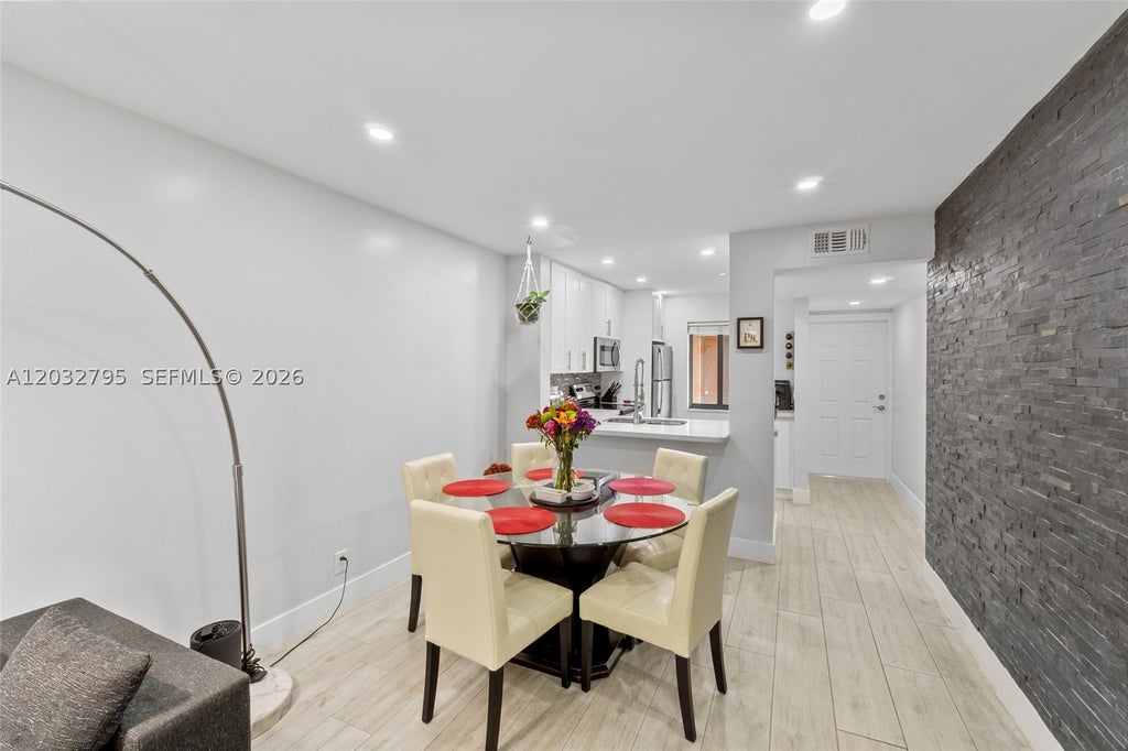 Photo of 10003 Winding Lake Rd #203, Sunrise, FL 33351 (MLS # A12032795)