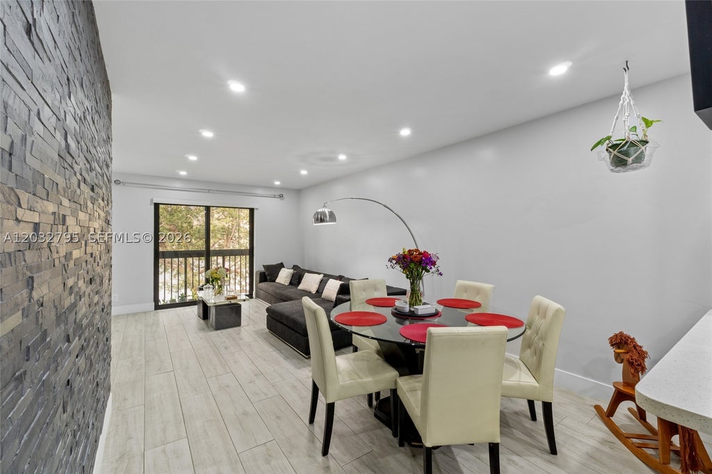 Photo of 10003 Winding Lake Rd #203, Sunrise, FL 33351 (MLS # A12032795)