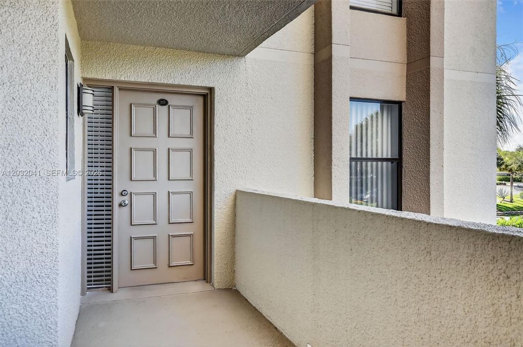 Photo of 5901 Camino Del Sol #207, Boca Raton, FL 33433 (MLS # A12032041)