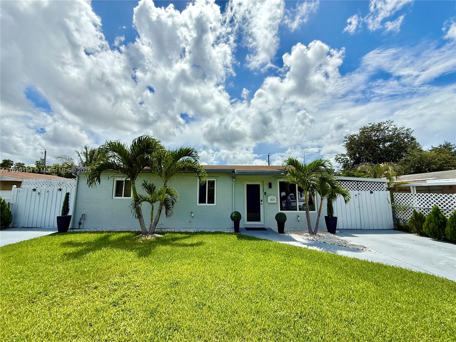 This luxuriously stunning one-story residence has been fully remodeled top to bottom with no expense spared. Features include a newer roof, brand-new flooring, modern tankless water heater, and impact windows and doors. The showstopping open kitchen offers a massive striking stone island, sleek cabinetry, and elite state-of-the-art appliances. Bedrooms include custom built-in closets, and the spa-inspired bathrooms feel like a five-star retreat, complete with jetted tub, frameless showers, TVs, and modern vanities. Freshly painted inside and out with a new, upgraded A/C system. Step outside to a private reimagined backyard oasis with a resurfaced pool, new elegant stone deck, and resort pergolas. Elite modern design and finishes throughout, luxury living at its finest—truly move-in ready!