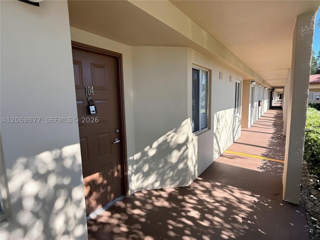 Photo of 1301 SW 142nd Ave #104-H, Pembroke Pines, FL 33027 (MLS # A12069877)