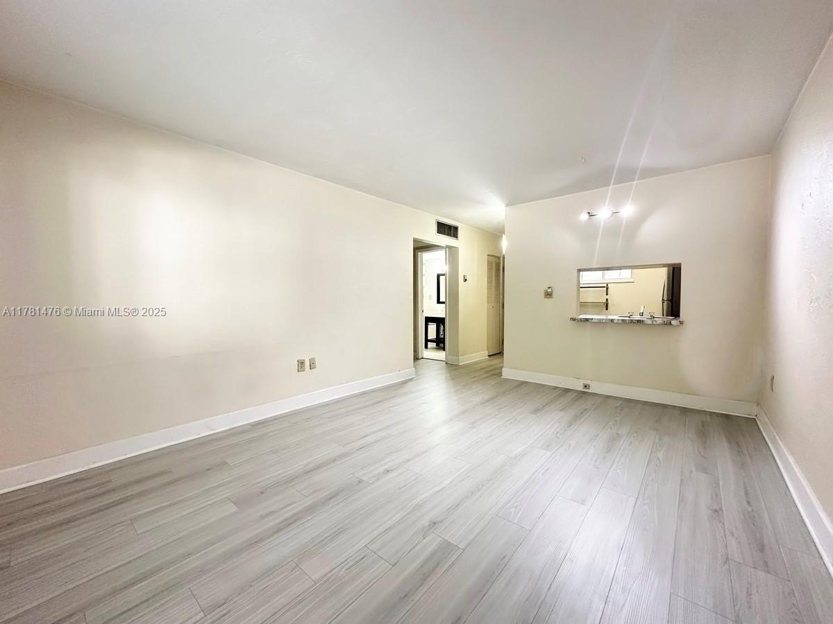 Beautiful 1 bedroom 1 bath first floor condo with newly installed floors and freshly painted. This unit features stainless steel appliances, impact windows, newer A/C and water heater. Amazingly located in the Village of Pinecrest within walking distance to Dadeland Mall, US-1, Metrorail station. Vacant and ready to move-in. Community is gated, offers pool, guest parking and laundry facilities. Unit comes with 1 assigned parking space. Easy to Show!!!