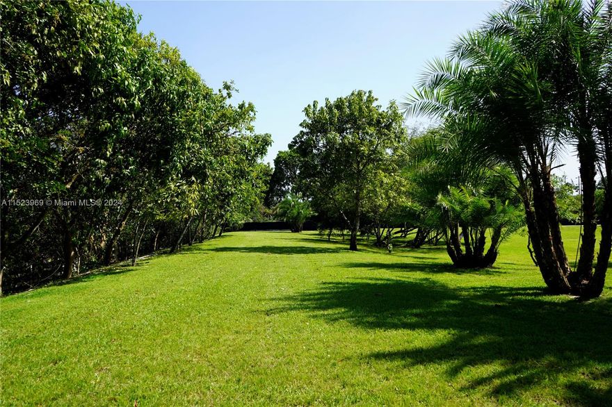 Rarely available 3.41 acre gated and fenced private compound in very exclusive Sunshine Ranches with completed plans ready to build dream home on of the highest elevations in area. Area is transforming in to multi million dollar properties in one of the best areas in all of South Florida to develop your custom built mansion. Pristine grounds with plenty of room for horse stables, tennis court, basketball court etc. No HOA and city water. Property already has a very nice 3 bed/2 bath 1800 sf Mediterranean home that you can live in while construction takes place. Property has many exotic coconut palm and fruit trees. Easy access to major highways and close to shopping, restaurants and schools!