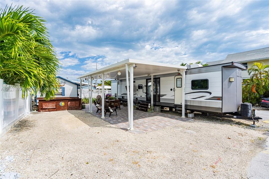 Corner lot located on a quiet one way street in the highly sought-after Calusa Campground. Property has direct canal access, featuring a 35’ dock and boat lift already in place. Property is being sold as LAND ONLY (RV not included) and offers the opportunity to place a new RV or potential to build a home in the future. Ideal as a vacation retreat, investment opportunity (community is short term rental friendly), or seasonal escape. This gated community offers a boat ramp, communal dockage, pool, clubhouse, child's playground, laundry facilities, and tennis, pickleball, and basketball courts.