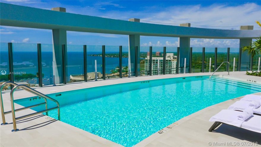 Live in luxurious splendor in Miami's newest & most exclusive waterfront development. Located in coveted Coconut Grove facing Biscayne Bay & the marinas, this 2 bedroom/2 bath unit features 10 ft. high ceilings with 270 degree views overlooking Coral Gables, Coconut Grove, Miami skyline & bay. Unit has 2 private terraces, spectacular kitchen with Wolf and Subzero appliances, marble counters, and custom built in closets in bedrooms.  Custom sheer blinds in all rooms & black outs in bedrooms. 1 assigned parking plus valet. Master has double shower and vanities. The Club Residences Tower has its own rooftop pool. Sitting on 6 waterfront acres the project has 550 feet of pools, unparalleled landscaping, amazing gym and spa and every amenity one desire. Walk to everything in the Grove! Amazing!