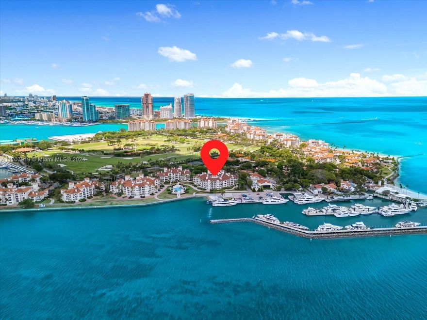 Experience the epitome of Fisher Island living from this stunning bayfront lanai with breathtaking sunset views over the Miami skyline! Arrive directly at your private patio by golf cart and step into this expansive ground-floor residence featuring 4 bedrooms and 4.5 baths. With 3,025 square feet of living space, the layout is perfect for both relaxation and entertaining. The chef's kitchen, finished in white and dove grey lacquer, is equipped with top-of-the-line Miele appliances and a cozy breakfast nook. Just a short distance from world-class amenities, including the Fisher Island Beach Club, Spa & Fitness Center, Pura Vida, Tennis, Padel & Pickleball Club, Vanderbilt Mansion Clubhouse, seven restaurants, the P.B. Dye Jr. Golf Course, two marinas, Island Gourmet Market, and more!