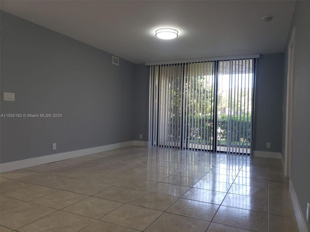 Photo of 5641 Riverside Dr #105B1, Coral Springs, FL 33067 (MLS # A11555162)