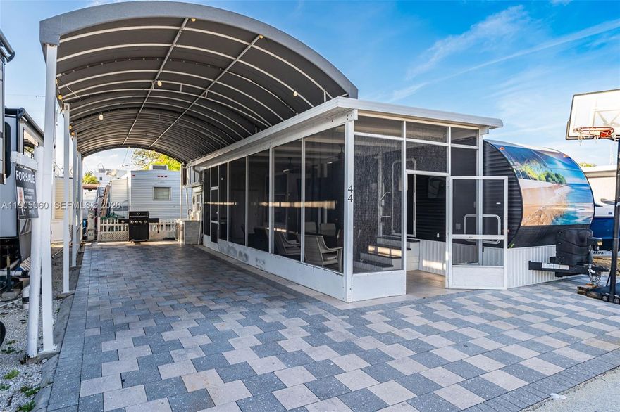 2019 2BR/1B 36.5 ft RV on a concrete slab with pavers. The lot has an insulated aluminum roof/patio, outdoor kitchen, TV, and a large awning with pavers. Use it as a weekend get-a-way and or a short-term rental property.             Calusa is one of the few communities in the Florida Keys that allow short term nightly rentals.  Just an hour's drive from Miami and you are in paradise. Calusa has many amenities like a marina/boat ramp, temporary dockage, boat storage, 24-hour security, tennis/pickleball, basketball court, playground, onsite laundry, pool and recreational hall. Additionally, the property is located close to world class fishing/diving, Miami International Airport, amazing local attractions/restaurants, shopping, entertainment, and health care.  Your island paradise awaits...