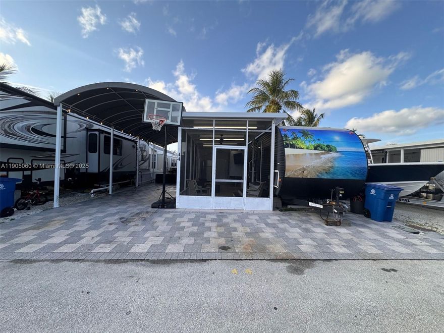 2017 2BR/1B 36.5 ft RV on a concrete slab with pavers. The lot has an insulated aluminum roof/patio, outdoor kitchen, TV, and a large awning with pavers. Use it as a weekend get-a-way, short or long term rental property. Calusa is one of the few communities in the Florida Keys that allow short term nightly rentals.  Just an hour drive from Miami and you are in paradise. Calusa has many amenities like a marina/boat ramp, temporary dockage, boat storage, 24-hour security, tennis/pickleball, basketball court, playground, onsite laundry, pool and recreational hall. Additionally, the property is located close to world class fishing/diving, Miami International Airport, amazing local attractions/restaurants, shopping, entertainment, and health care.  Your island paradise awaits...