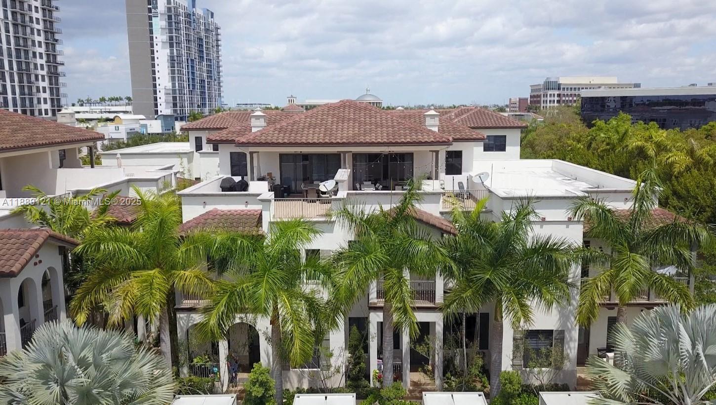 Downtown Doral is the most modern and desirable area where everyone wants to live! excellent location, just steps away from Doral Downtown Charter School (DTD). Enjoy three levels of comfort and style, a two-car garage, and high ceilings that create a spacious and inviting atmosphere. Featuring large bedrooms, 3 full bathrooms, and a guest half bath. The modern and functional kitchen is perfect for entertaining, allowing you to enjoy great moments with family and friends in a space that combines beauty and comfort. On the third floor, you’ll find not only a convertible fourth bedroom but also a spacious terrace where you can admire the stars and giving you that resort-style feeling every day, walking distance to top-rated restaurants, shops, and entertainment. Come now!