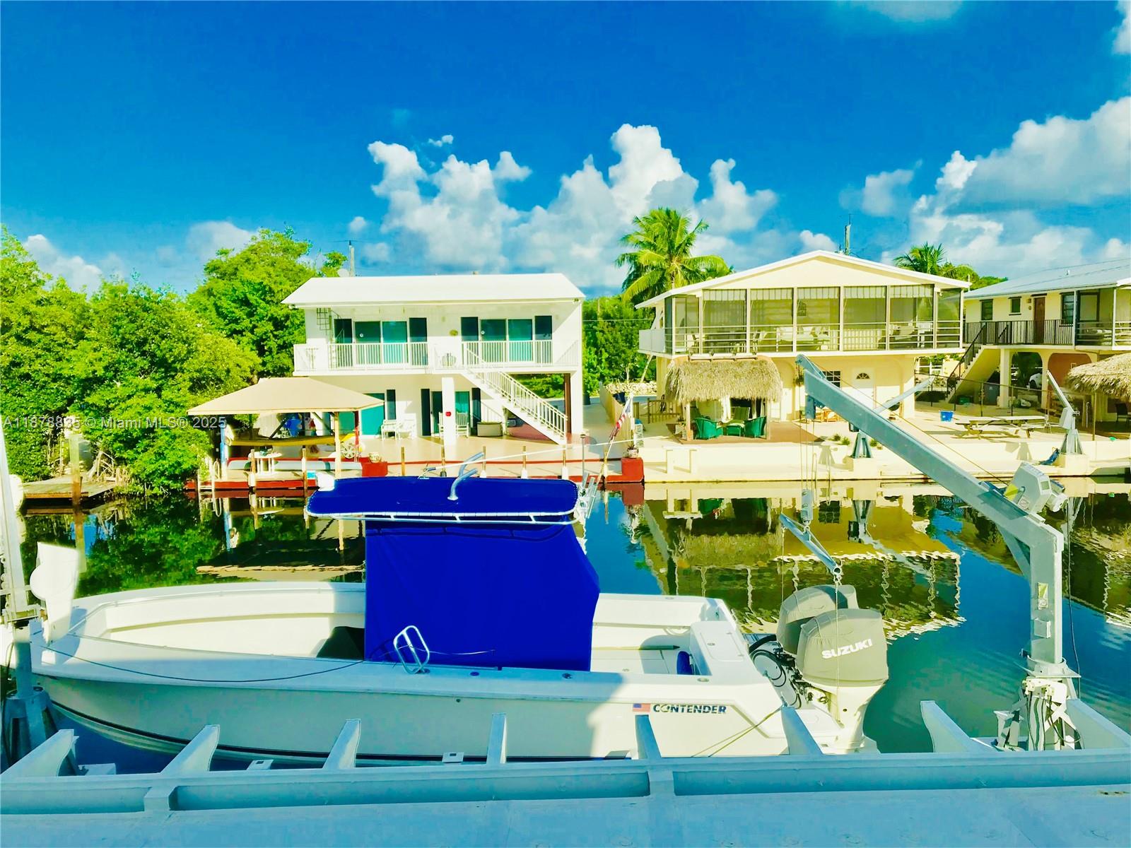 This UNIQUE and rarely to be found property is 1,496 SF living space, 3bed/2baths, waterfront direct bay access, private concrete dock for a 30 FT boat with amazing views of the sun rise on the bay, completely renovated, beautiful kitchen, SS appliances, granite countertop, two bedroom in the first floor and master bedroom in second floor with canal from view, washer & dryer. No Pets