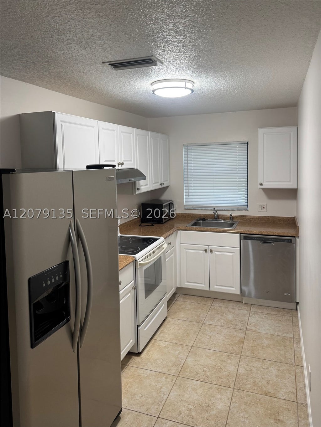 Photo of 5040 Sanctuary Way #C, West Palm Beach, FL 33417 (MLS # A12079135)