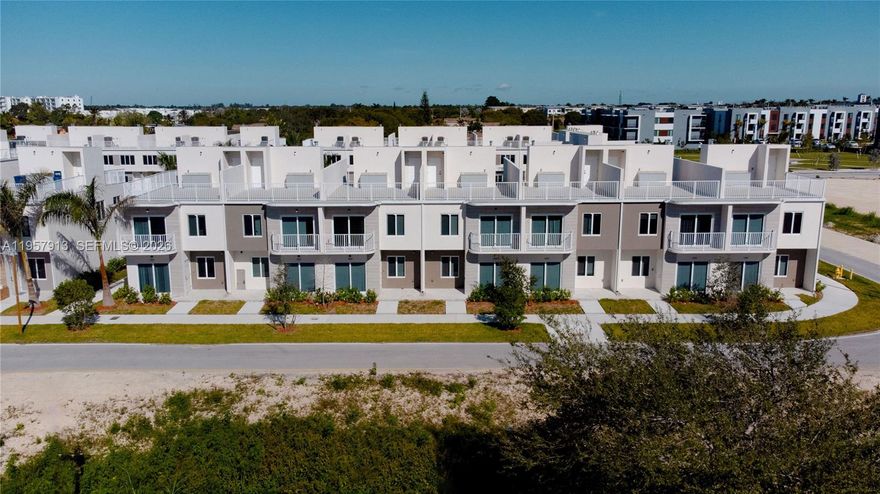 Grace Homes Townhouses Move-in-Ready modern Open Rooftop Townhouse with private balcony in the heart of South Miami-Dade. Conveniently located near US-1 and Florida’s Turnpike (Exit 6). Grace Homes is situated in the rapidly developing Naranja neighborhood with easy access to shopping and charter school options. This residence is part of a boutique community of only 32 homes. Offering 4 bedrooms and 4 full bathrooms, including a ground-level guest suite, the thoughtfully designed layout provides flexibility for families, guests, or home office needs. The home features a modern open kitchen, contemporary finishes, and porcelain tile flooring throughout—no carpet—creating a clean, sleek, and low-maintenance living space. Enjoy two parking spaces and buyer incentives including closing cost credits and a low interest rate when using the preferred lender and title company. No pet restrictions. Easy to show. No Flood requirement