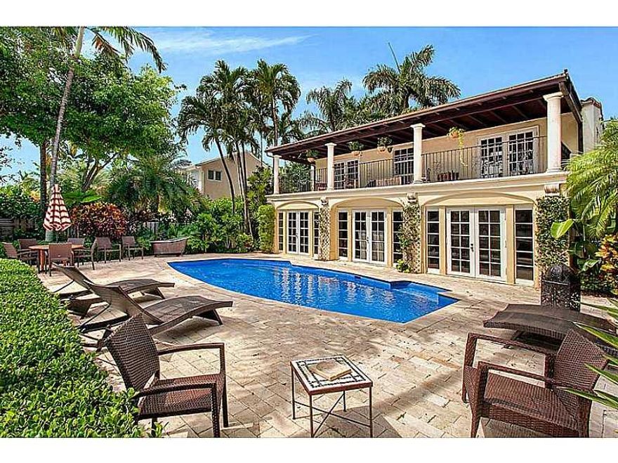 Enjoy captivating bay views on coveted Venetian Island in this charming Spanish style home on an expansive 10,500 SF lot. Complete w/  1 bdrm cottage, home boasts 60' waterfront, gated courtyard, heated pool, private boat dock w/ lift, Florida room & balc onies w/ view from every room. Features incl. a den w/ courtyard entrance, travertine/wood floors, views from formal dining, living & family room, master & upstairs bdrm w/ large terrace & spacious wooden dock perfect for outside dining/entertaining.