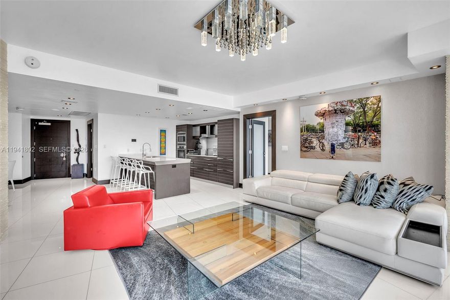 Experience the ultimate luxury lifestyle in this spectacular 2-bedroom, 2-bathroom + den residence at Epic. Enjoy a spacious balcony with breathtaking views of the ocean, bay, and city. Recently renovated with high-end finishes, the residence features an open kitchen equipped with Miele appliances, a Sub-Zero refrigerator, electric shades, and Missoni wallpaper. Fully furnished with designer décor and lighting. The primary suite offers two custom walk-in closets and a spa-style bathroom with a jacuzzi. One assigned parking space is included. Live a true five-star lifestyle with Zuma, Area 31, five pools, room service, and exclusive perks including VIP access to Joia Beach, dining discounts at Boulud Sud, Novikov, and Hell’s Kitchen, plus tickets to Silverspot Cinema.