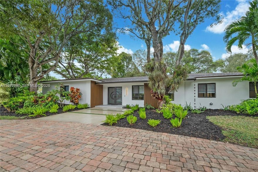 Fully renovated 4BR/3BA pool home in a quiet neighborhood near top-rated schools. Features two living areas, formal dining, and a 2-car garage. Modern kitchen with Bosch built-in oven, cooktop, appliances w/extended warranty, pot filler, custom recessed ceiling, and designer lighting. Updated bathrooms with three heated bidet toilets and LED backlit mirrors. 13-ft hurricane-impact sliding doors open fully for seamless indoor-outdoor living with pool views. All new impact windows and doors. Interlock driveway, new stucco, landscape lighting, new patio, and Ring system. Move-in ready. Top rated schools in the area.