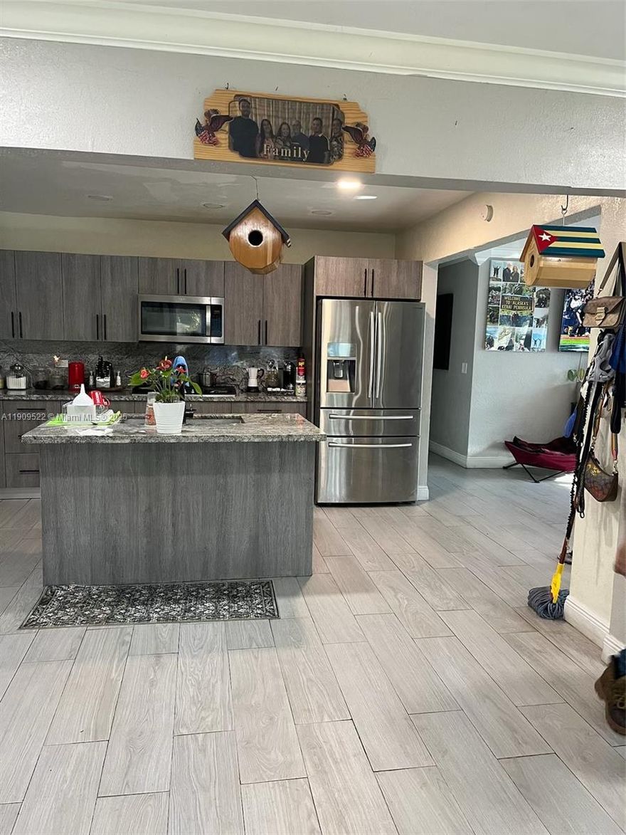 Close to everything, the 4/2 home offers approximately 2,143 sq ft of interior living space for families wanting more space, inside the home and out.  Generous lot size of approx. .25 acres.  great backyard for entertaining.  Outdoor space for pool, patio, play area, etc.  Structural/upgraded features, the home features a “brand new roof,” “high-impact windows,” “high-impact doors,” screened-in patio, and fresh paint.  The house is single-story, centrally located in East Miramar, “close to major highways, Fort Lauderdale Airport, Beaches, Shopping Centers, Parks.”  Possibility for extra space, side entrance or guest suite, separate access, upgraded roof & windows, one-level living, and extra space for rental —minutes to major amenities.”