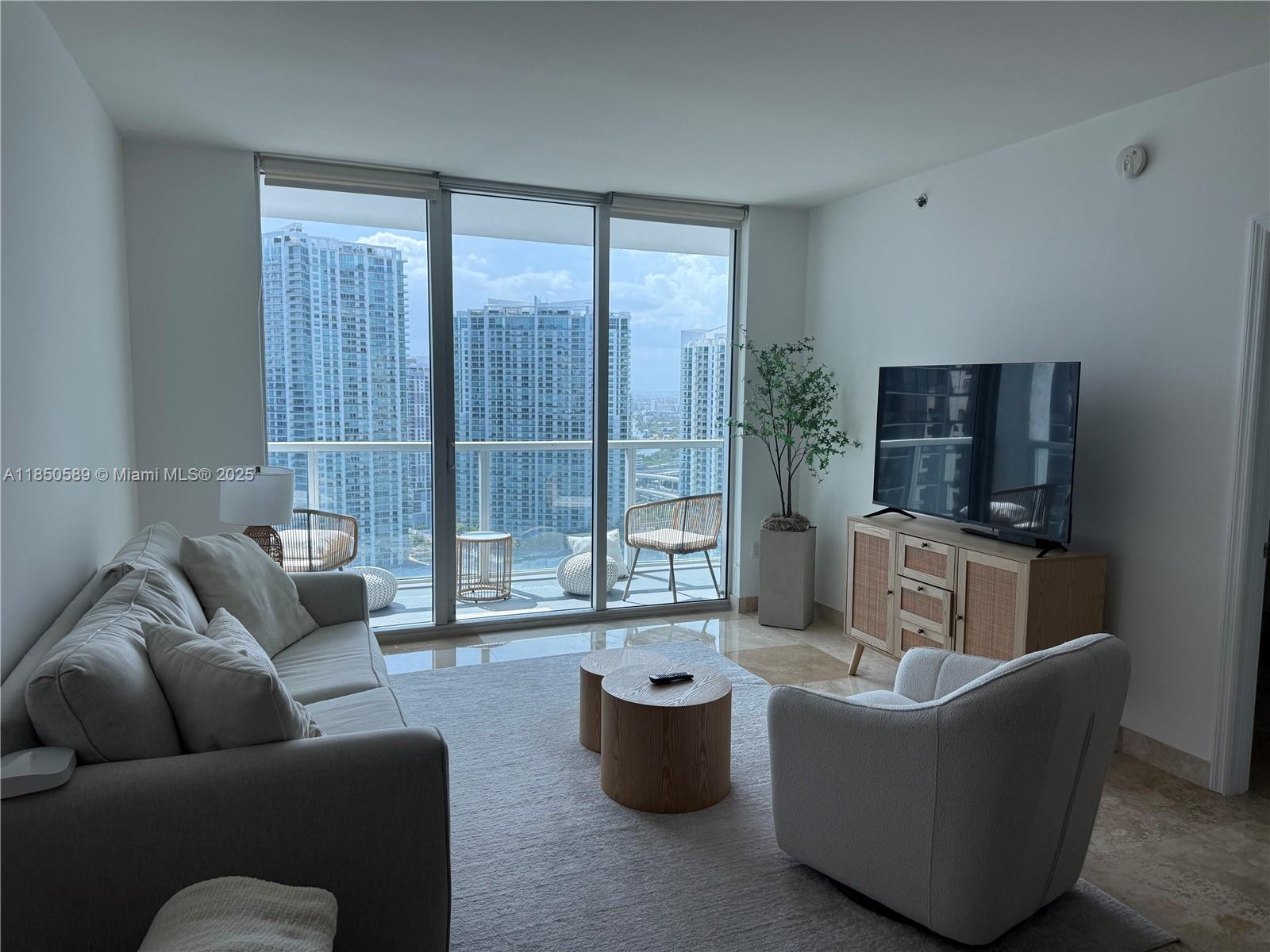 Large one-bedroom plus den floor plan at 500 Brickell. Features include stainless steel appliances, marble flooring throughout, a spacious bedroom, dual sinks in the bathroom, separate tub and shower, large walk-in closet, oversized private terrace, and in-unit washer and dryer. Cable and internet are included in the rent. The building offers excellent amenities, including two pools (one rooftop pool with stunning views), a fitness center, club room, party room, billiard room, wine cellar, spa/sauna, hot tub, and movie theater. Prime location across from Brickell City Centre and Riverside, with easy walking access to Whole Foods, Publix, Metromover station, and numerous restaurants and nightlife spots.