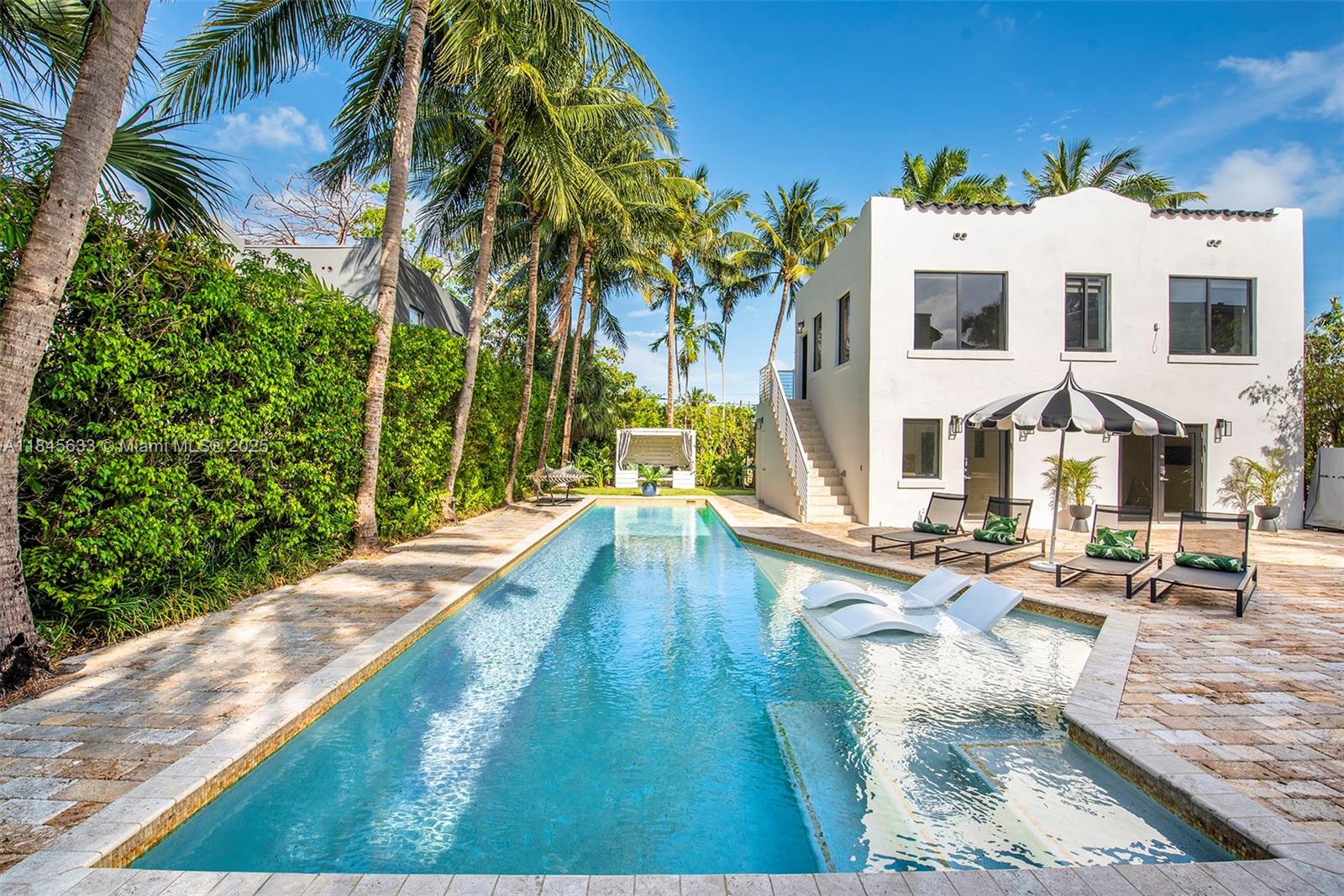 Exceptional rental opportunity in the heart of Miami Beach featuring a full two-story guest house. This 7-bedroom
estate lives like a private resort, set on a 14,000 SF lot with lush landscaping for total privacy. The backyard offers
standout amenities including a dining terrace, expansive pool, gazebo, and outdoor living areas. The main house
showcases an open floor plan filled with natural light, a generous dining area, media room, and four bedrooms
upstairs. The guest house provides three additional bedrooms and two bathrooms, ideal for extended stays,
guests, or work-from-home space. Minutes from Miami Beach Golf Club, shopping, dining, and the beach, this
property offers the perfect blend of privacy, space, and convenience.