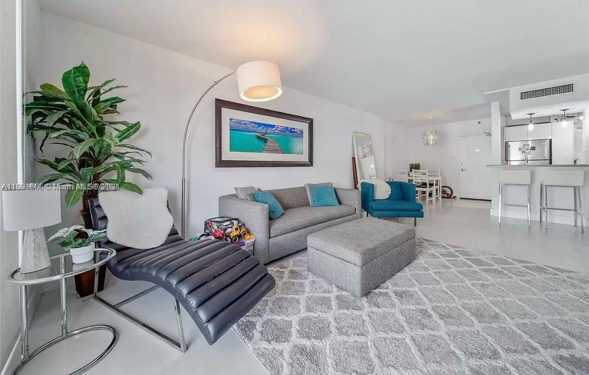 Remodeled unit Mirador WITH BALCONY views west to bay & east to ocean! Open floor kitchen, dining and living room! Kitchen, bath and flooring all redone. Impacted windows have been upgraded in the building. In building store for convenience, upgraded new gym, common areas, and great outdoor spaces to lounge, pool, hot tub.