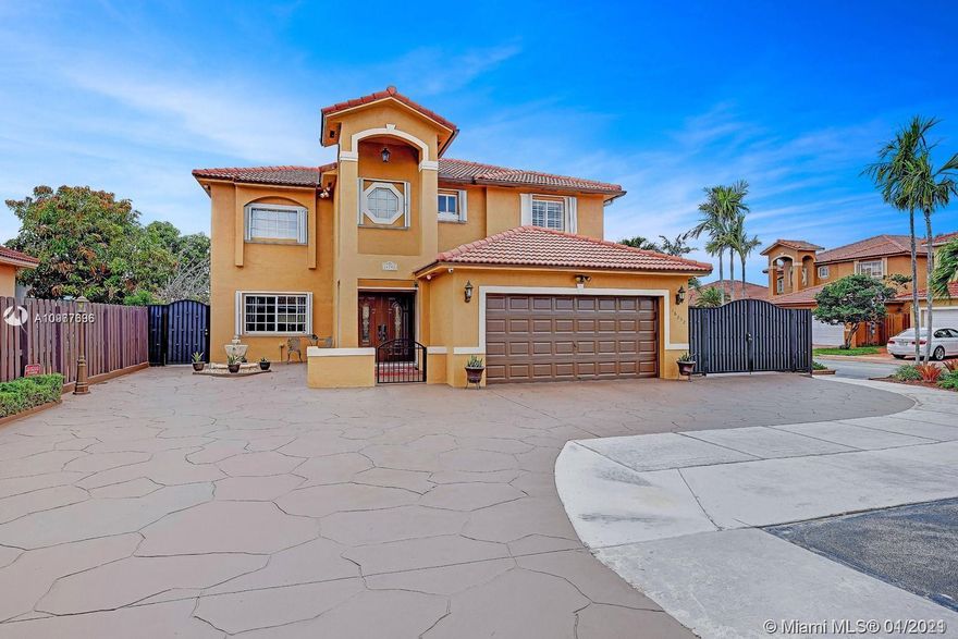 Looking for your perfect home? Look no further! Come get lost in this breathtaking home located in Pelicans Point. This home sits on two standard lots and is the largest home in the community. It's driveway holds up to 20+ cars and side gate can house a large RV or 40+ foot boat. The sellers spared no expense when building and upgrading this home. It is equipped with 4 bedrooms (one of which is on the ground level), 3 bathrooms, a gorgeous heated salt water pool with updated pavers, a built in travertine tiled BBQ, double terrace on the 1st and 2nd floor, a brand new aluminum fence, accordion shutters, new top of the line (energy efficient) AC unit, a very favorable layout and much more!!! This home is great to have friends and family over, or for a growing family. Come view today!