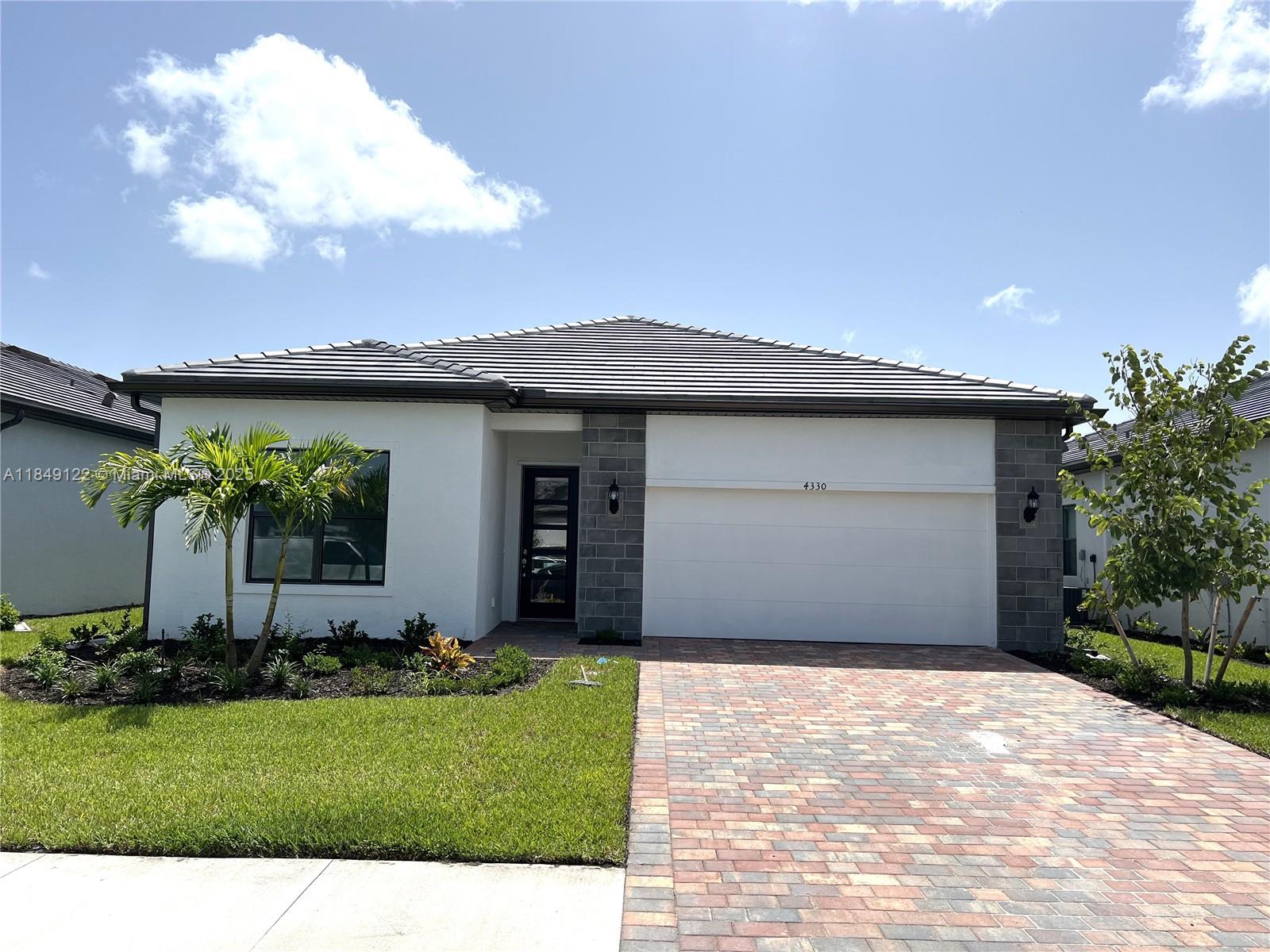 Beautiful single-family home in Ave Maria Florida, with 3 bedrooms and 2 bathrooms, featuring a spacious living and dining area with a screen porch with a view of one of the ponds in Ave Maria, where you can sit and relax. Lovely Kitchen with an island, quartz countertops, and stainless steel appliances Elegant front door, high ceilings, high-efficiency air conditioning system, and an oversized 2-car garage. Ceramic tile flooring throughout the entire home. Very close to the beautiful Water Park and the Town Center.