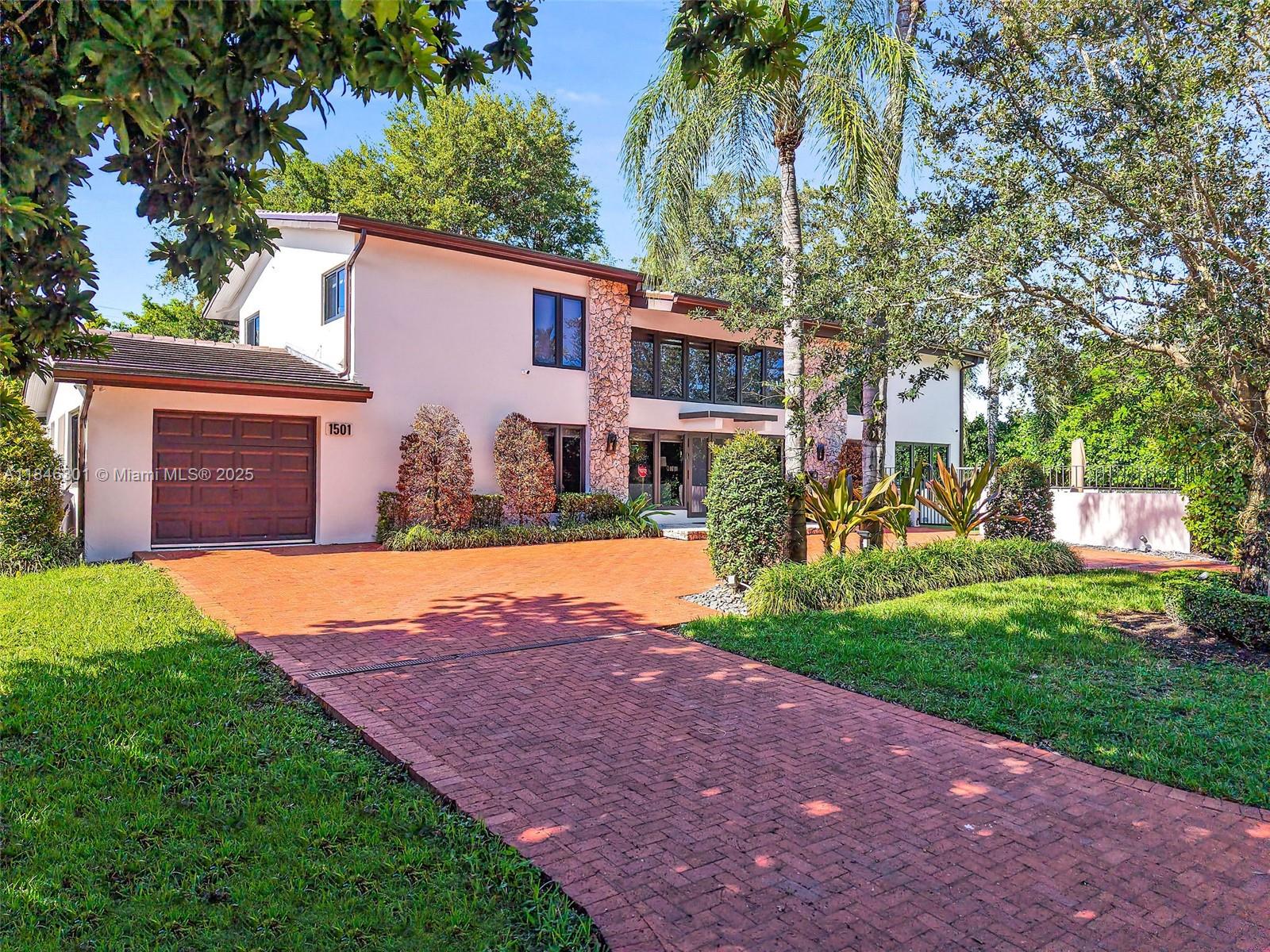 Don't miss this opportunity to own a beautifully renovated home in one of Coral Gables’ most prestigious neighborhoods! Located near the Coral Gables Country Club/Biltmore area, this 2-story, 4BD/3BA residence offers 3,000+ SF of refined living on a spacious corner lot. Features include vaulted ceilings, new roof, impact windows & doors, porcelain flooring, updated luxury baths, and a gourmet Italian kitchen boasting Bosch appliances and custom cabinetry. Additional highlights: large laundry room, stylish bar area, and a circular driveway with ample guest parking. Minutes from golf, top schools, Miracle Mile, and fine dining—this is Coral Gables living at its finest!